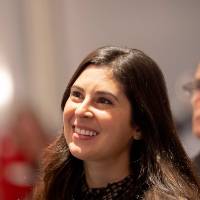 Woman looking off-camera and smiling